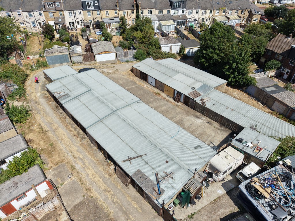 Lot: 76 - GARAGE SITE WITH POTENTIAL - High level drone footage from southern end